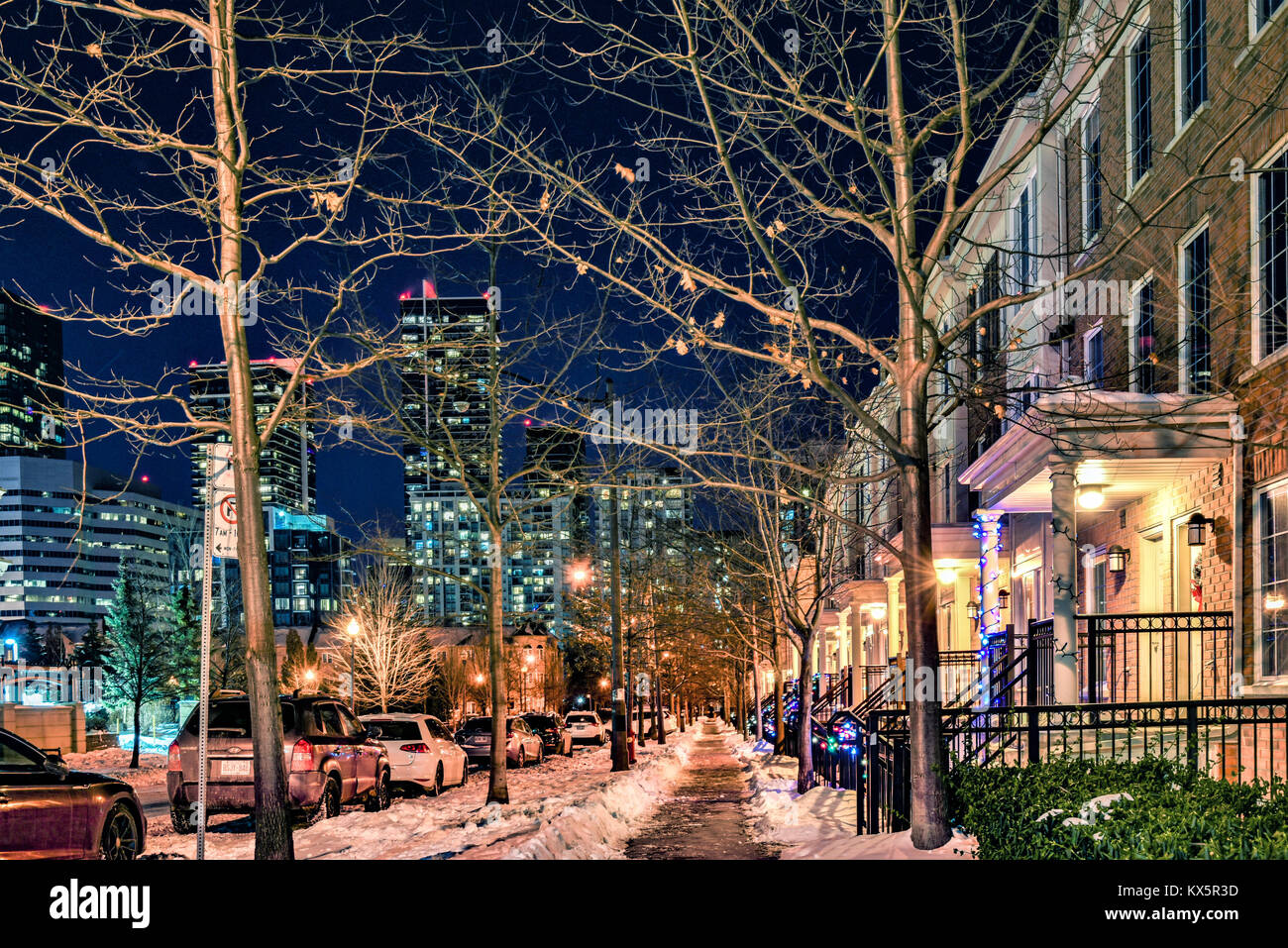 Night shot of a neighborhood in North York, Toronto, with snow and Christmas decoration Stock Photo