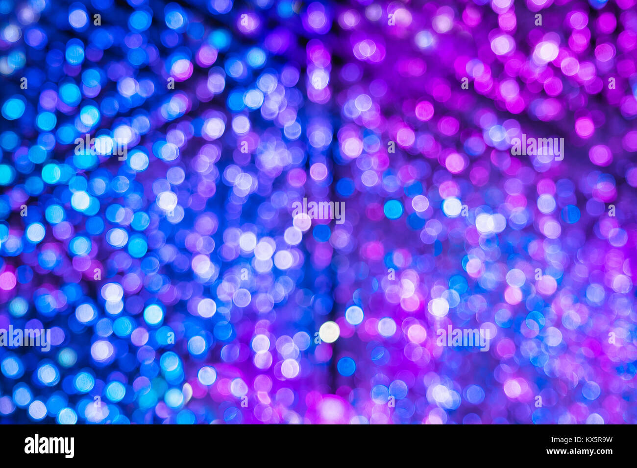Abstract blue bokeh merge with purple bokeh light background Stock