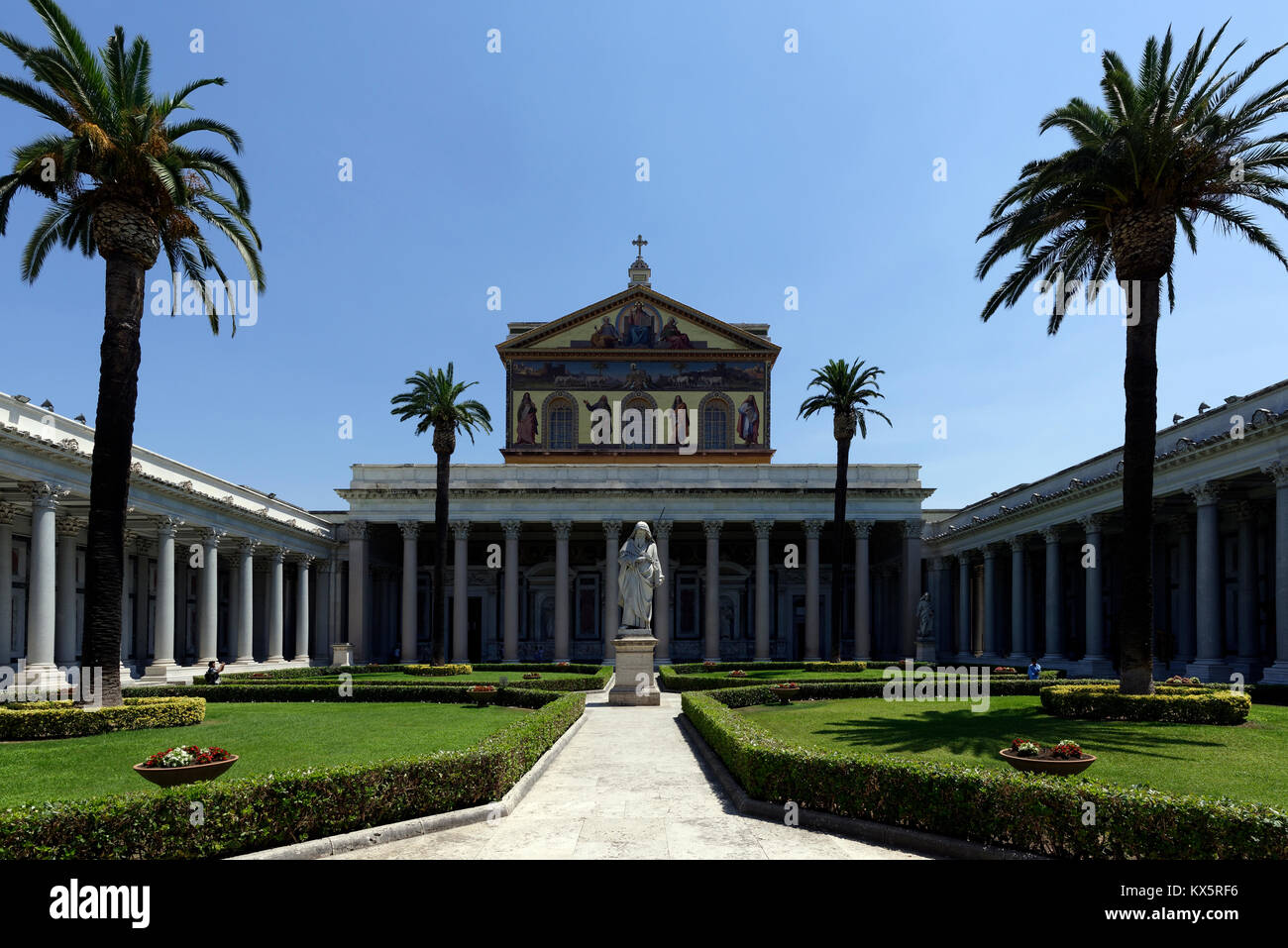 The courtyard with its portico of white granite columns of the Papal Basilica of St. Paul outside the Walls. Rome, Italy. Erected during the 4th centu Stock Photo