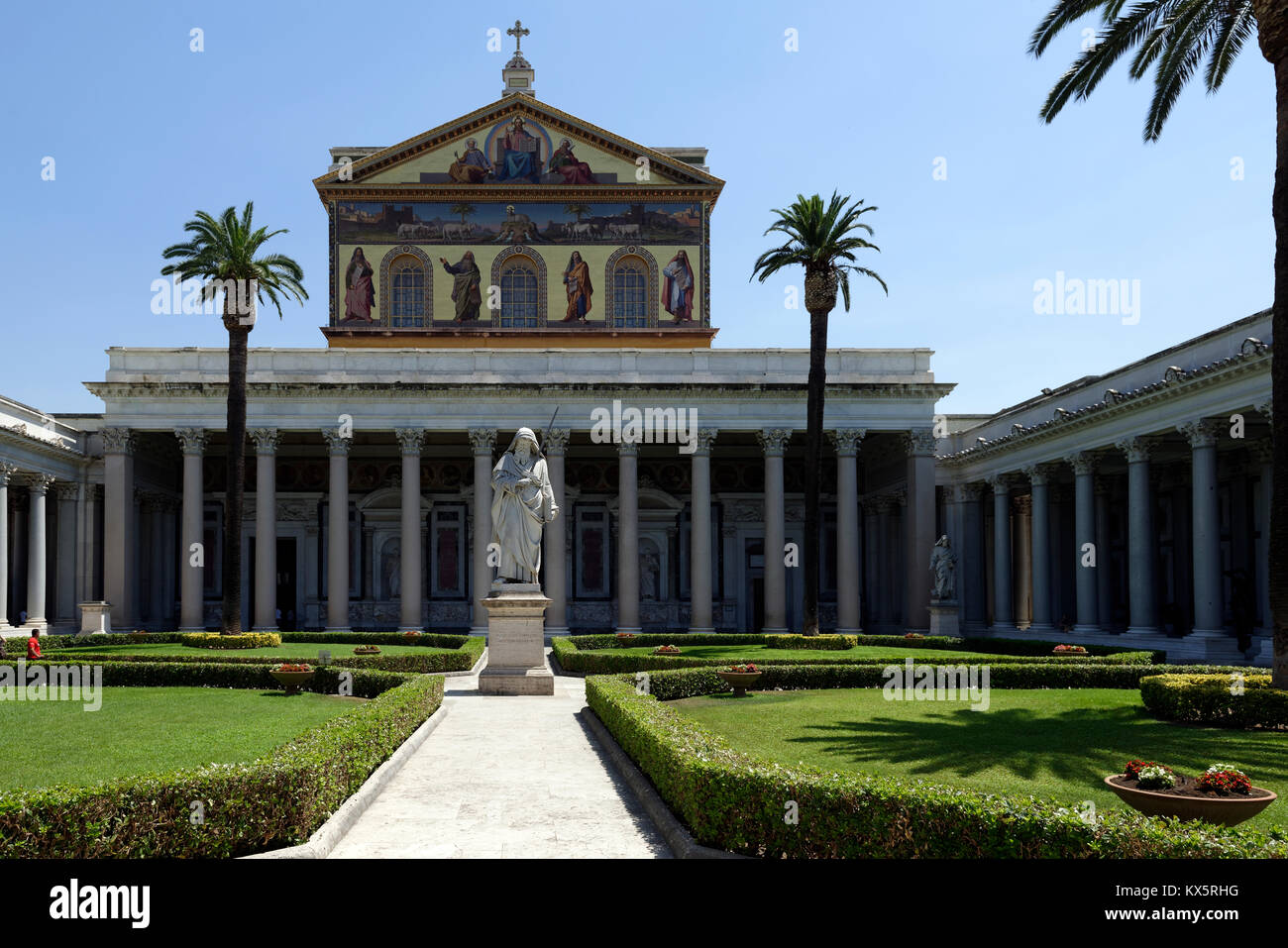 The courtyard with its portico of white granite columns of the Papal Basilica of St. Paul outside the Walls. Rome, Italy. Erected during the 4th centu Stock Photo
