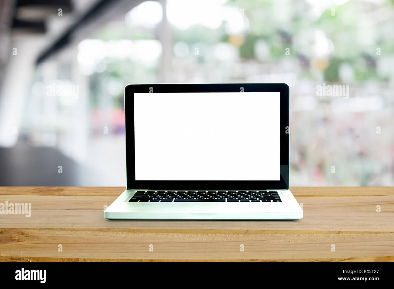 Computer laptop on workplace with office blur background with empty