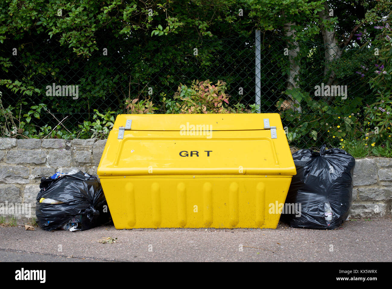Yellow grit container in the street Stock Photo Alamy
