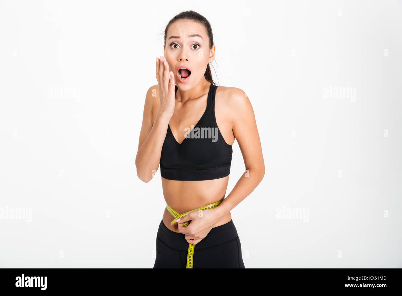 Woman holding tape measure around waist - Stock Image - F020/7701 - Science  Photo Library