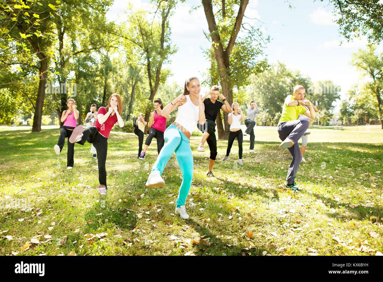 large group of young people training Tae Bo, outdoor Stock Photo Alamy