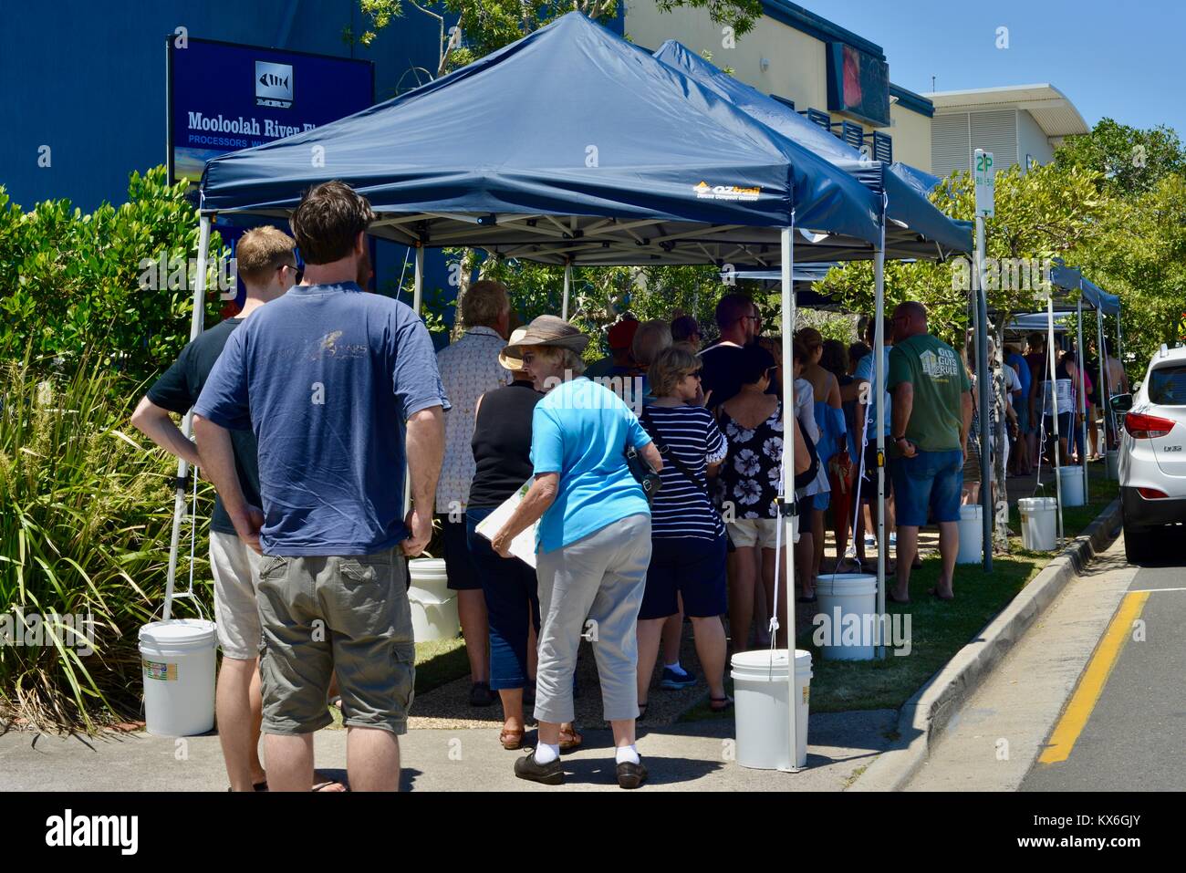 Lines of customers waiting to buy fresh seafood the day before