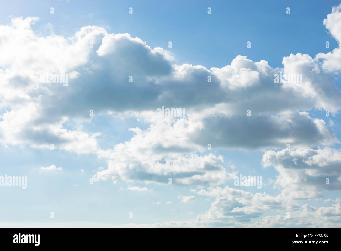 Dreamy fluffy white clouds on blue sky background Stock Photo - Alamy