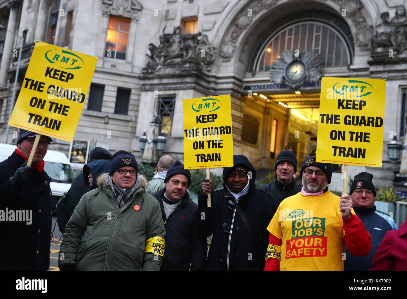 London, London, UK. 8th Jan, 2018. Rail, Maritime and Transport (RMT) union members hold placards at Waterloo Station as Northern, Merseyrail, South Western Railway and Greater Anglia workers went on strike over separate issues including the role of train guards and the extension of driver-only services, in London, Britain on Jan. 8, 2018. Credit: Tim Ireland/Xinhua/Alamy Live News Stock Photo