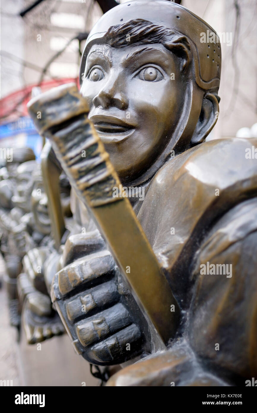 Close-up of Our Game, bronze sculpture by Canadian artist Edie Parker, front of Toronto Hockey Hall of Fame Museum, downtown Toronto, Ontario, Canada Stock Photo