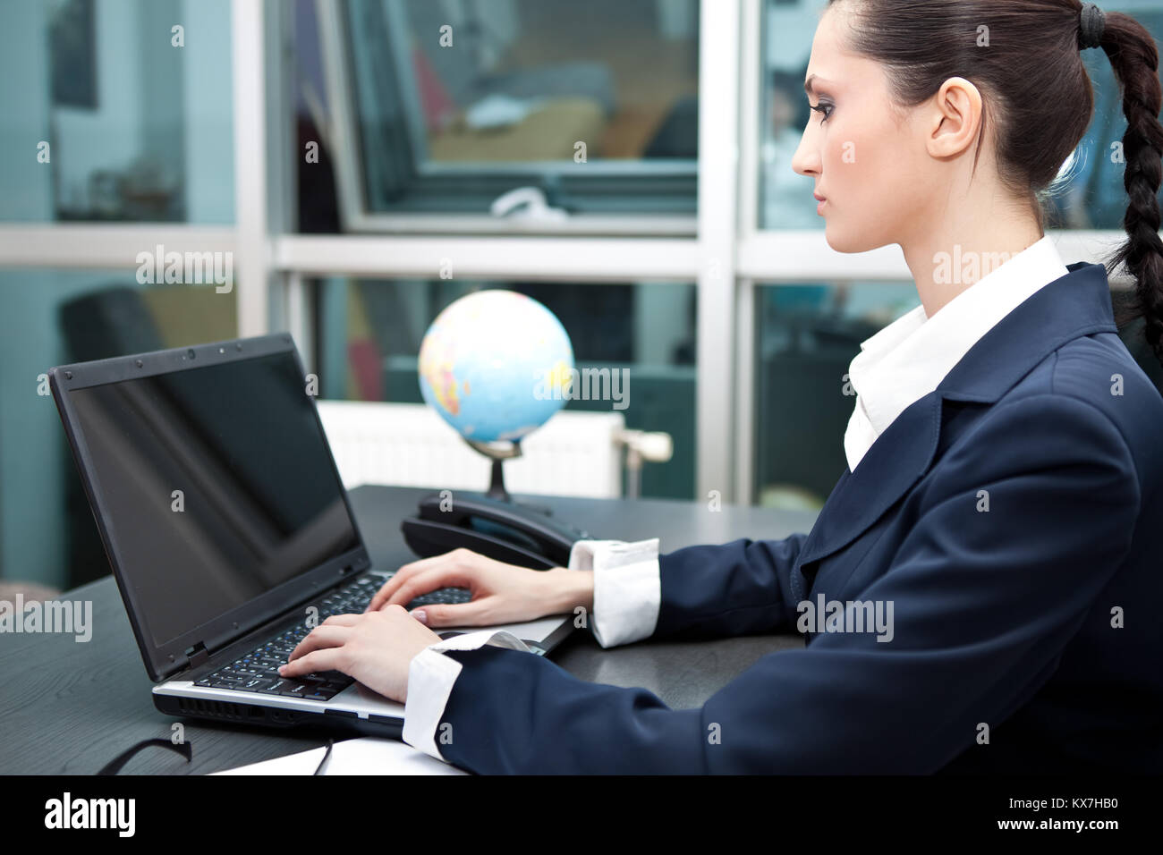young business woman working on laptop in her office Stock Photo - Alamy