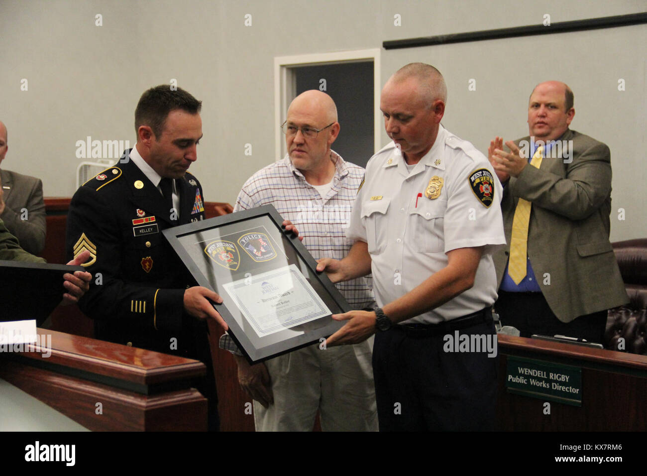 Staff Sgt. Robert Kelley and civilian Kirby were honored by West Jordan