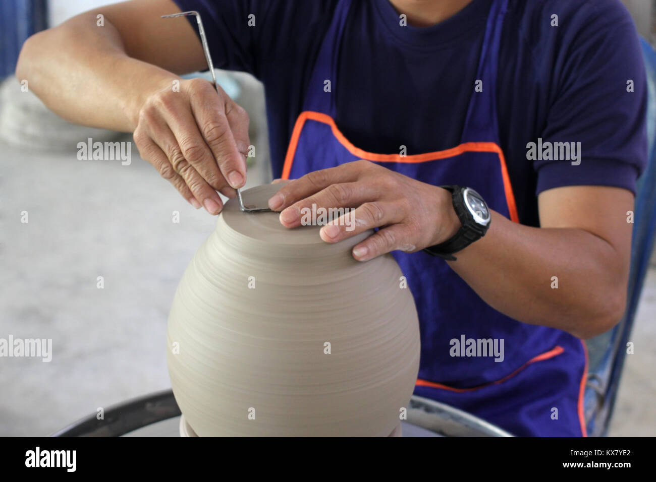 potter working on pottery wheel in pottery workshop Stock Photo - Alamy