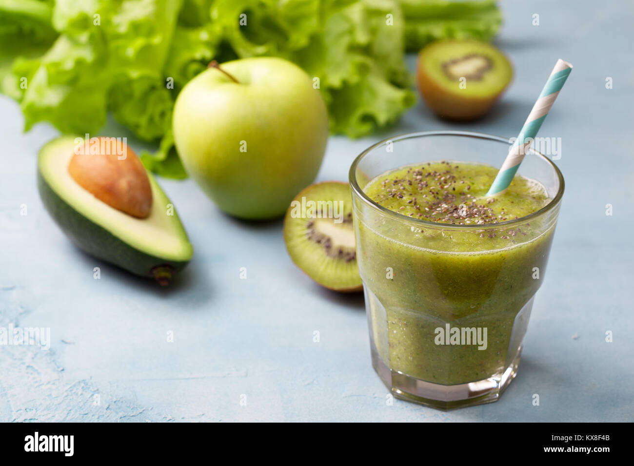 green smoothies in glassful with fresh vegetables and herbs:  avocado, apple, kiwi. detox smoothies Stock Photo