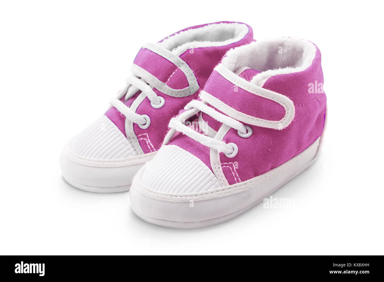 Pink baby girl shoes isolated over a white background Stock Photo - Alamy