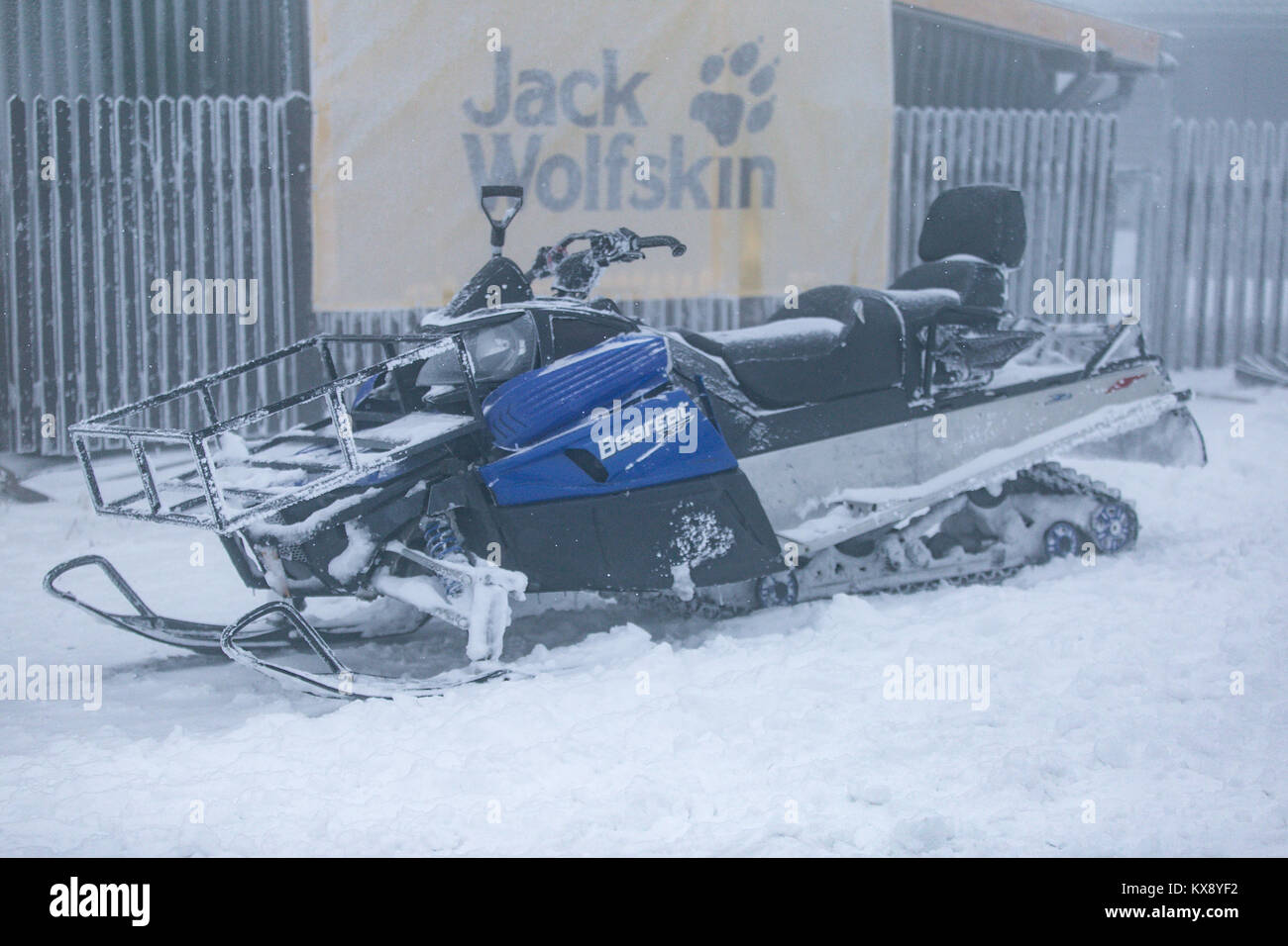 A snowmobile for hire allowing to travel in difficult winter conditions on snow and ice. Photo taken on a Skrzyczne mountain after overnight snowfall. Stock Photo