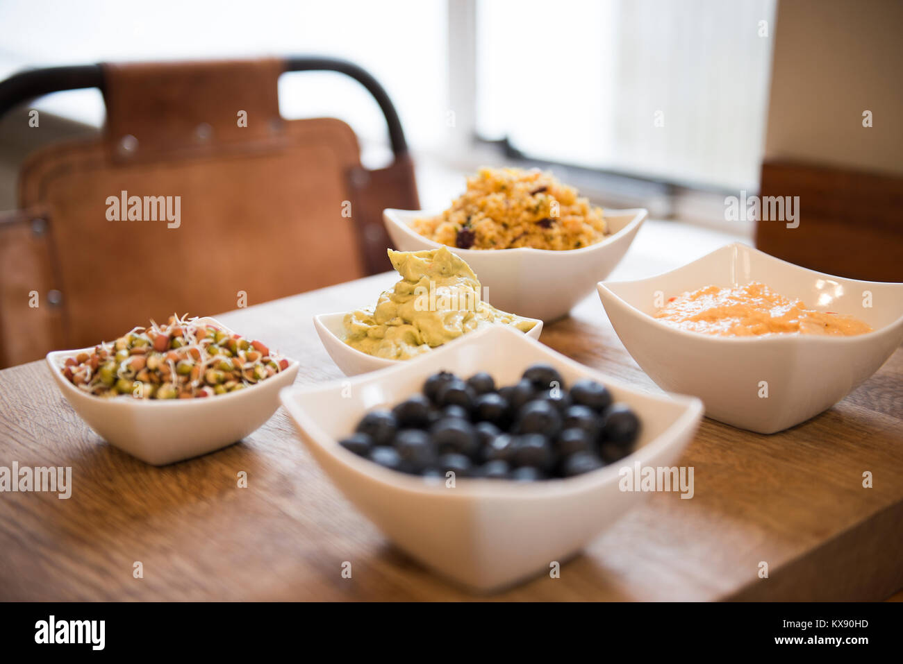 Bowls of healthy tapas food on wooden board Stock Photo Alamy