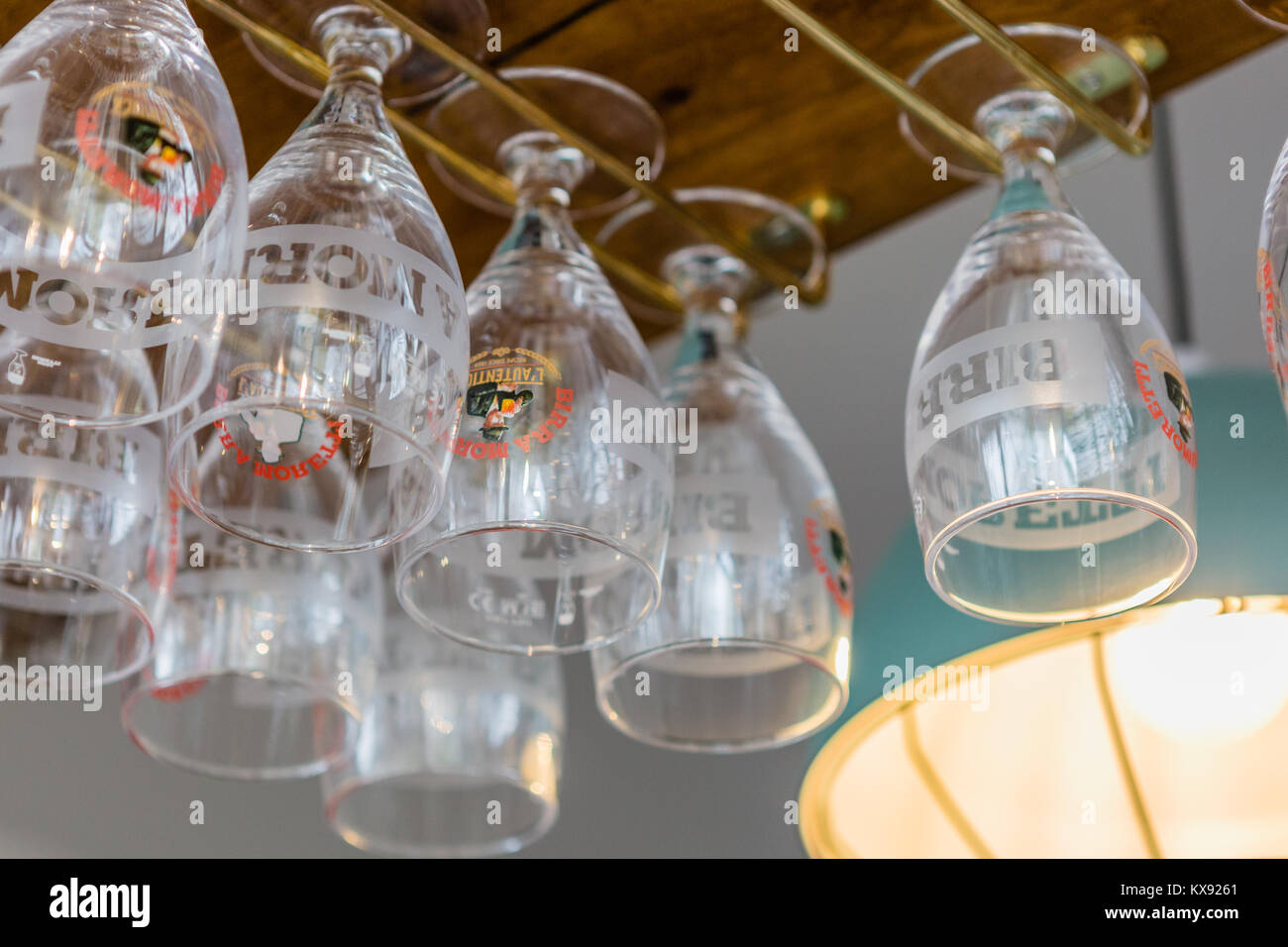 Beer glasses hanging on rack Stock Photo Alamy