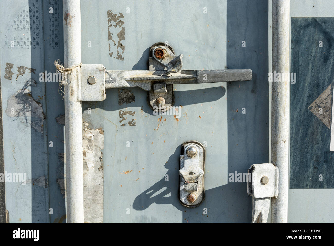 Closeup view of the worn door handle lock of an intermodal shipping container. Stock Photo