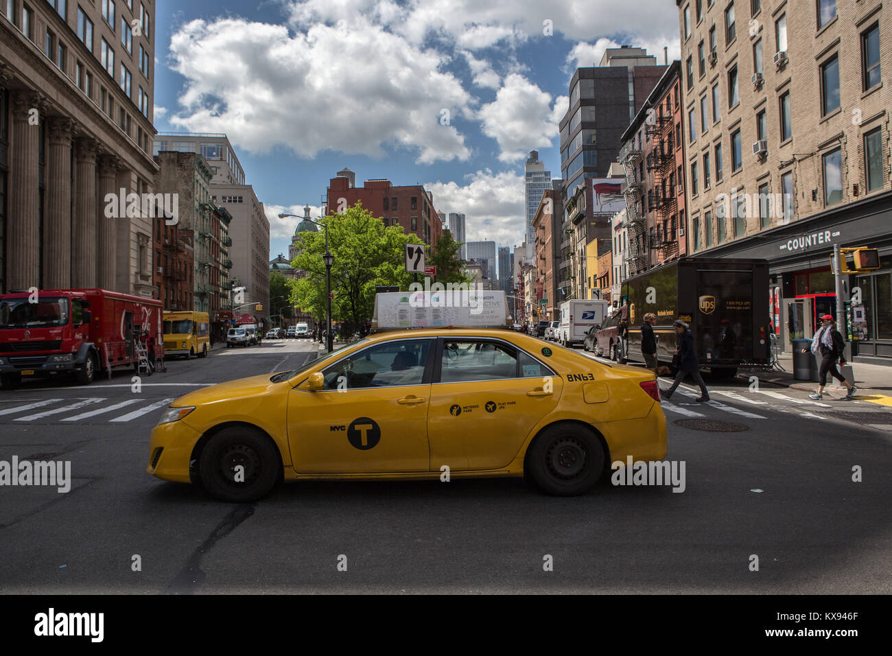A yellow cab in Chelsea, NY Stock Photo