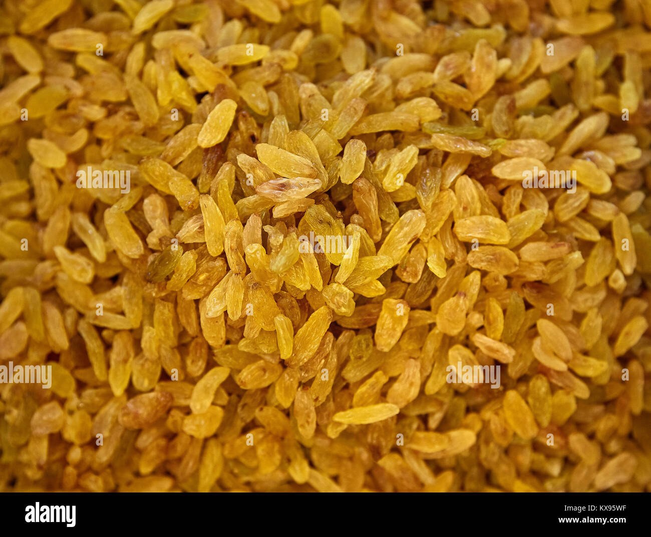 Raisins Background. Yellow Sultanas. Golden Dried Seedless Grapes Top View Stock Photo