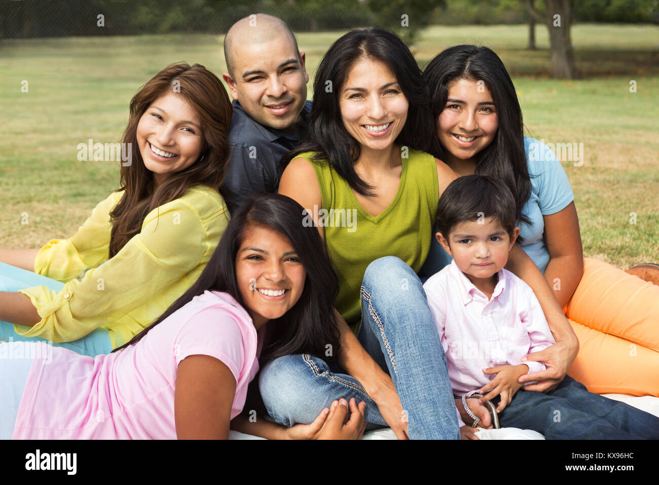 Big Hispanic family smiling outside. Stock Photo