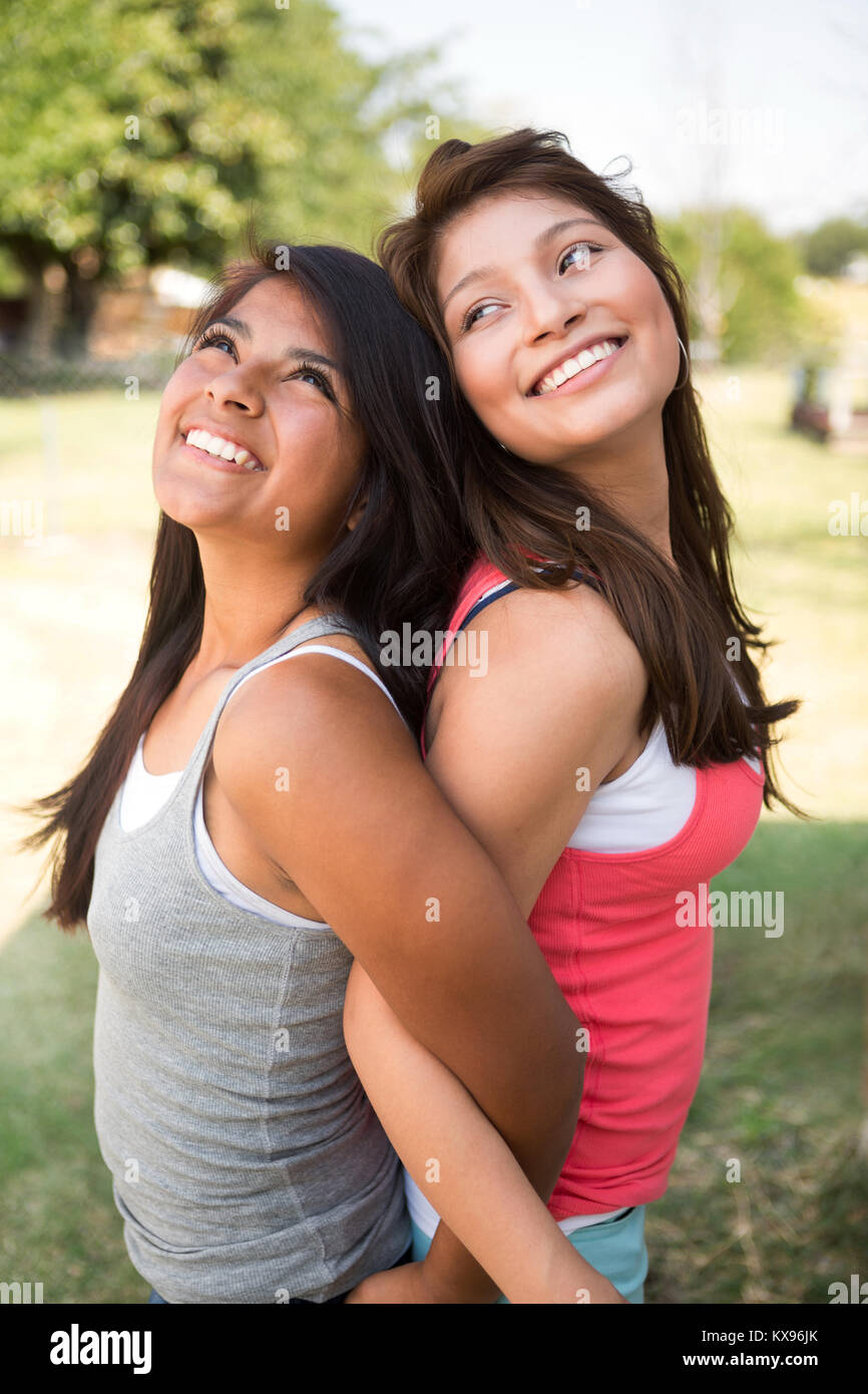 Sisters laughing and having fun outside. Stock Photo