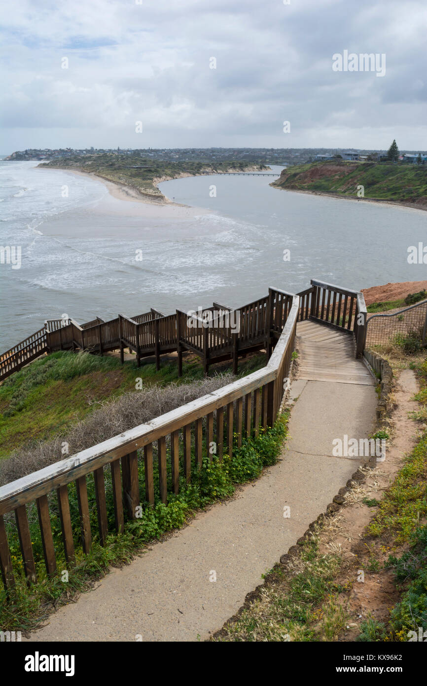 Southport Beach, SA, Australia: October 10, 2016 - From the steps, showing deminished land mass, bulging water ways of the Onkaparinga River and high  Stock Photo