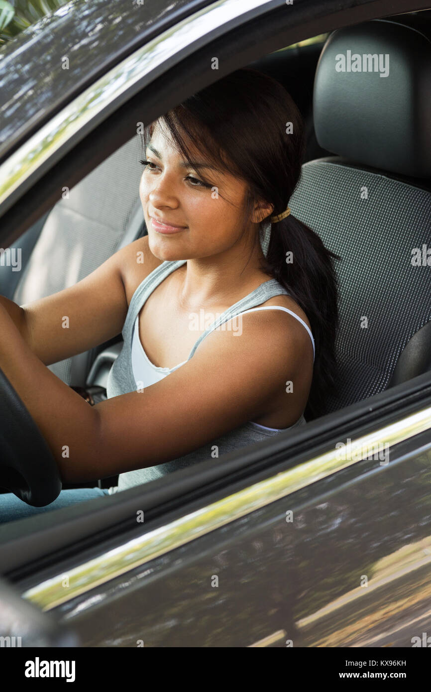 Young teenage girl driving. Stock Photo