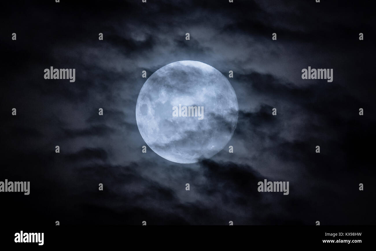 Full moon in the night sky with clouds Stock Photo - Alamy