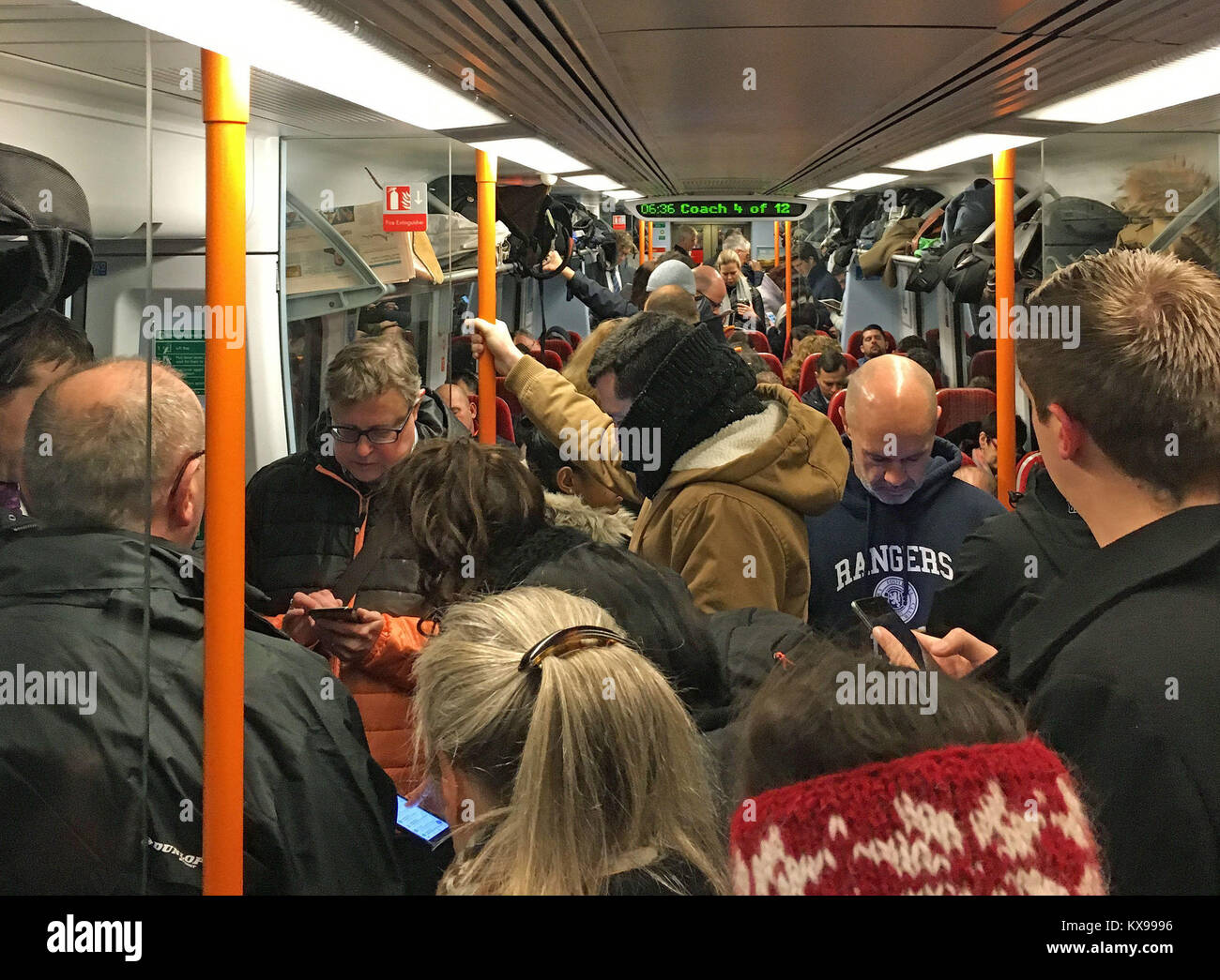 Commuters ride a crowded South Western Railway train on the Portsmouth to London Waterloo line as workers in five rail companies stage a fresh wave of strikes in the bitter disputes over the role of guards, causing disruption to services in the first full week back to work after the festive break. Stock Photo