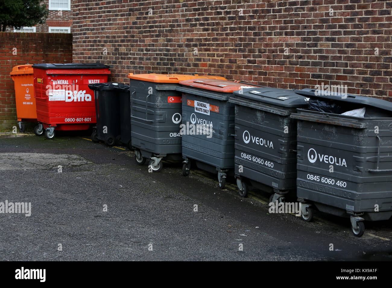 A selection of bins pictured behind the shopping district in Chichester, West Sussex, UK Stock