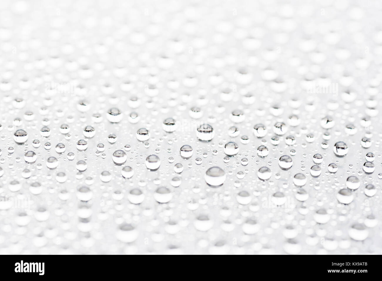 Abstract water drop on surface of white background with selective focus Stock Photo