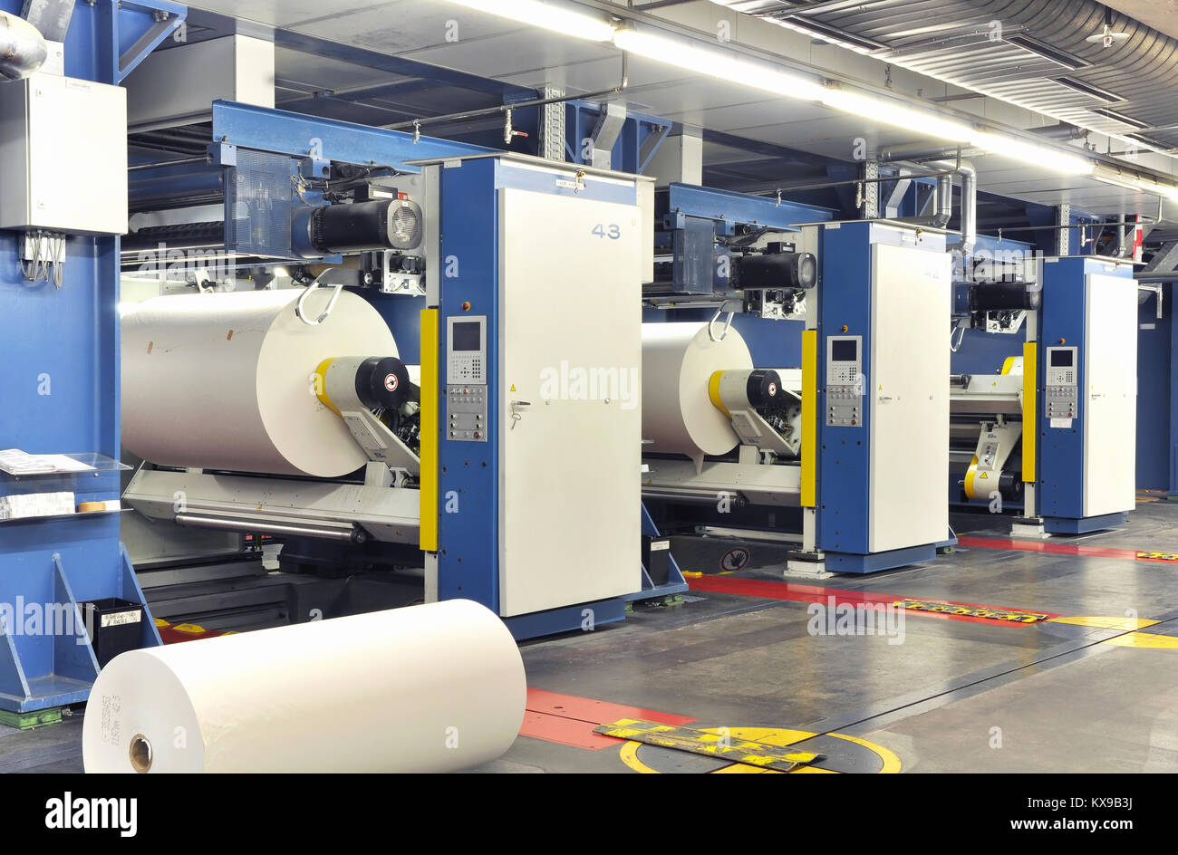 Paper rolls in a printing machine of a large print shop Stock Photo - Alamy