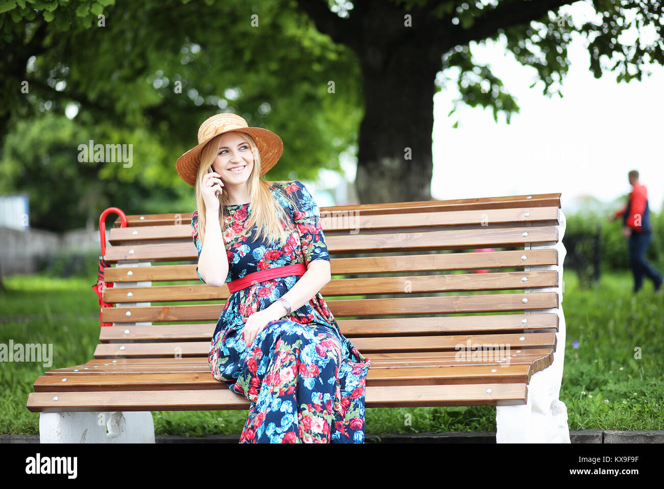 Girl in the street with an umbrella Stock Photo - Alamy