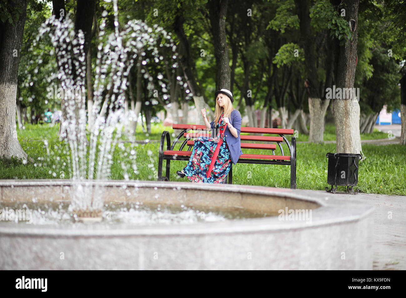 Girl in the street with an umbrella Stock Photo - Alamy