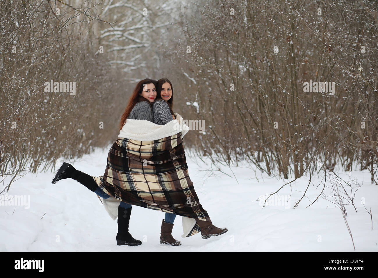 Beautiful girl in a beautiful winter park Stock Photo - Alamy