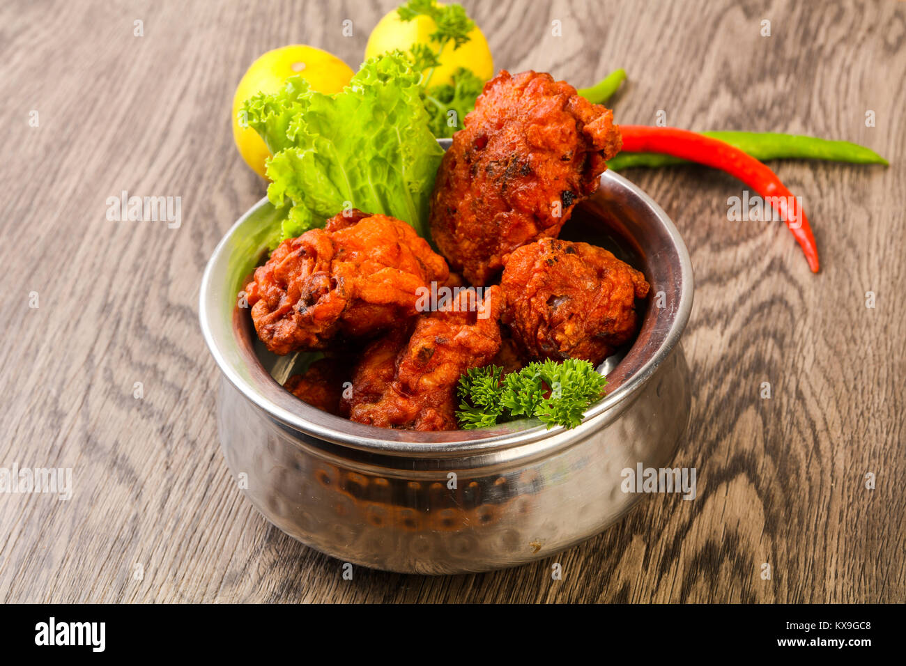 Indian traditional cuisine Chicken lollipops with spices Stock Photo