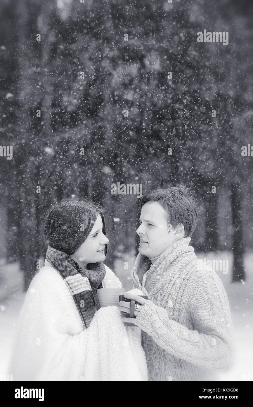 A loving couple on a winter walk. Man and woman on a date in the Stock