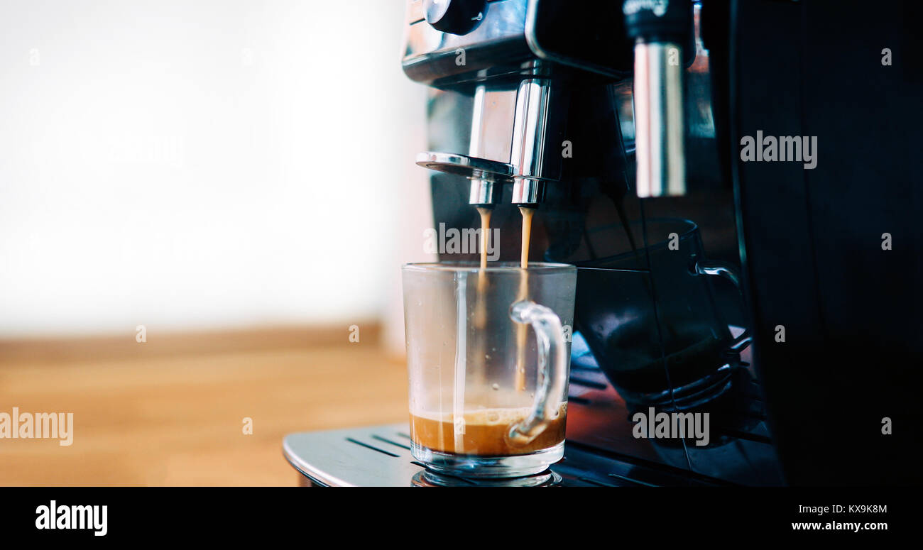 Coffee machine making coffee in morning with crema Stock Photo Alamy