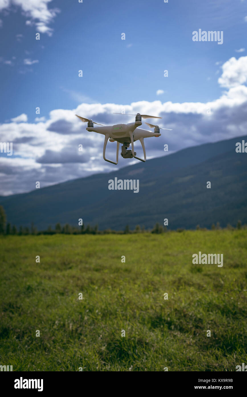 Drone flying over a landscape Stock Photo