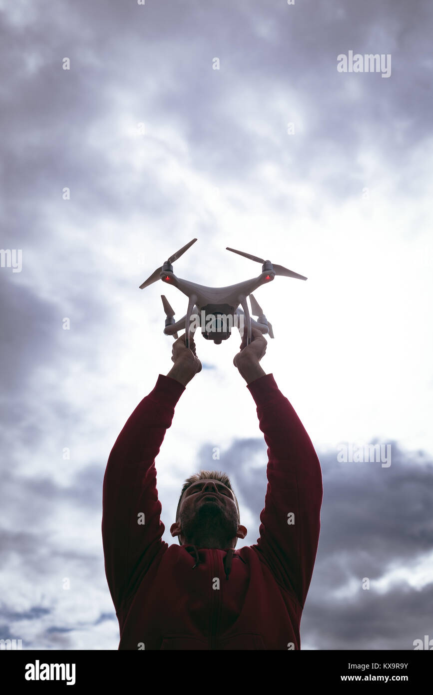 A man with a drone in his arms Stock Photo