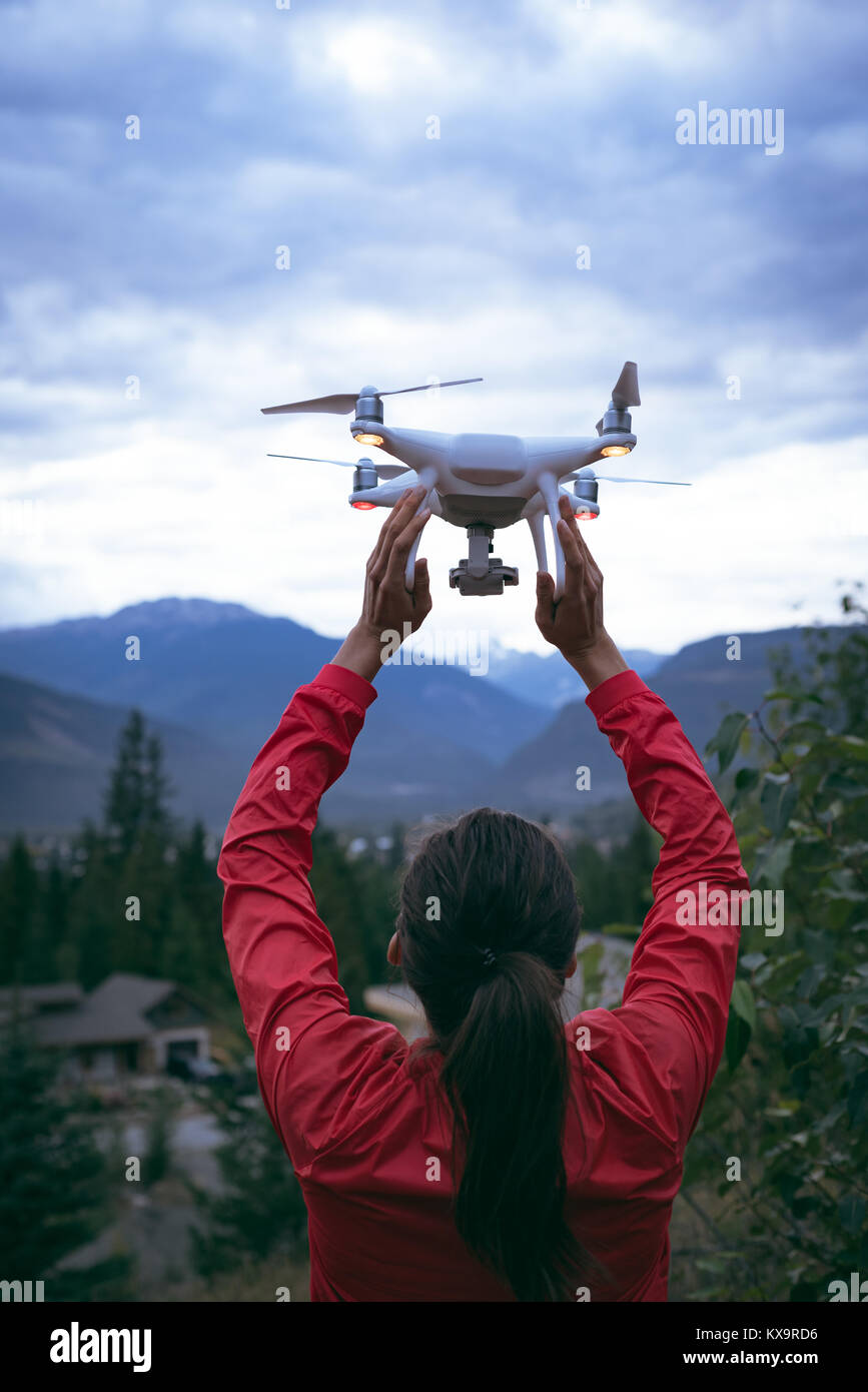 A woman with a drone in her arms Stock Photo