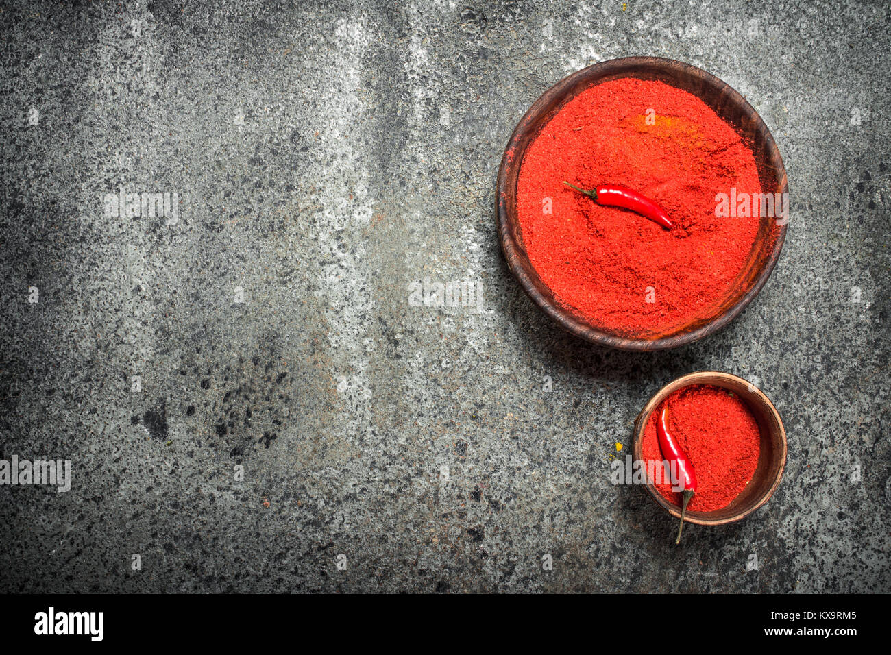 Ground red pepper in a bowl. On a rustic background Stock Photo Alamy