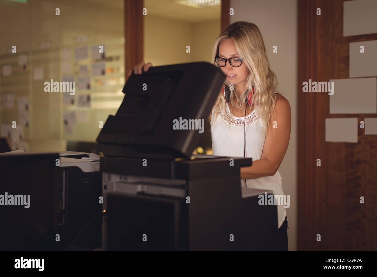 Executive using photocopy machine in office Stock Photo