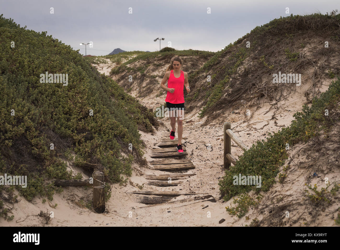 Woman jogging on beach fit hi-res stock photography and images - Alamy