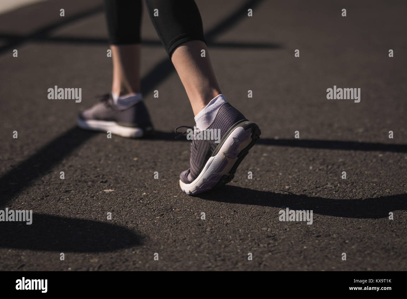 Runner feet walking on road Stock Photo Alamy