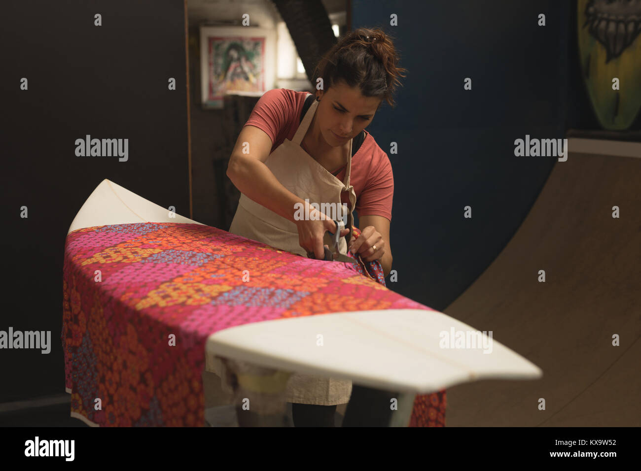 Female worker cutting design clothes with scissor Stock Photo Alamy