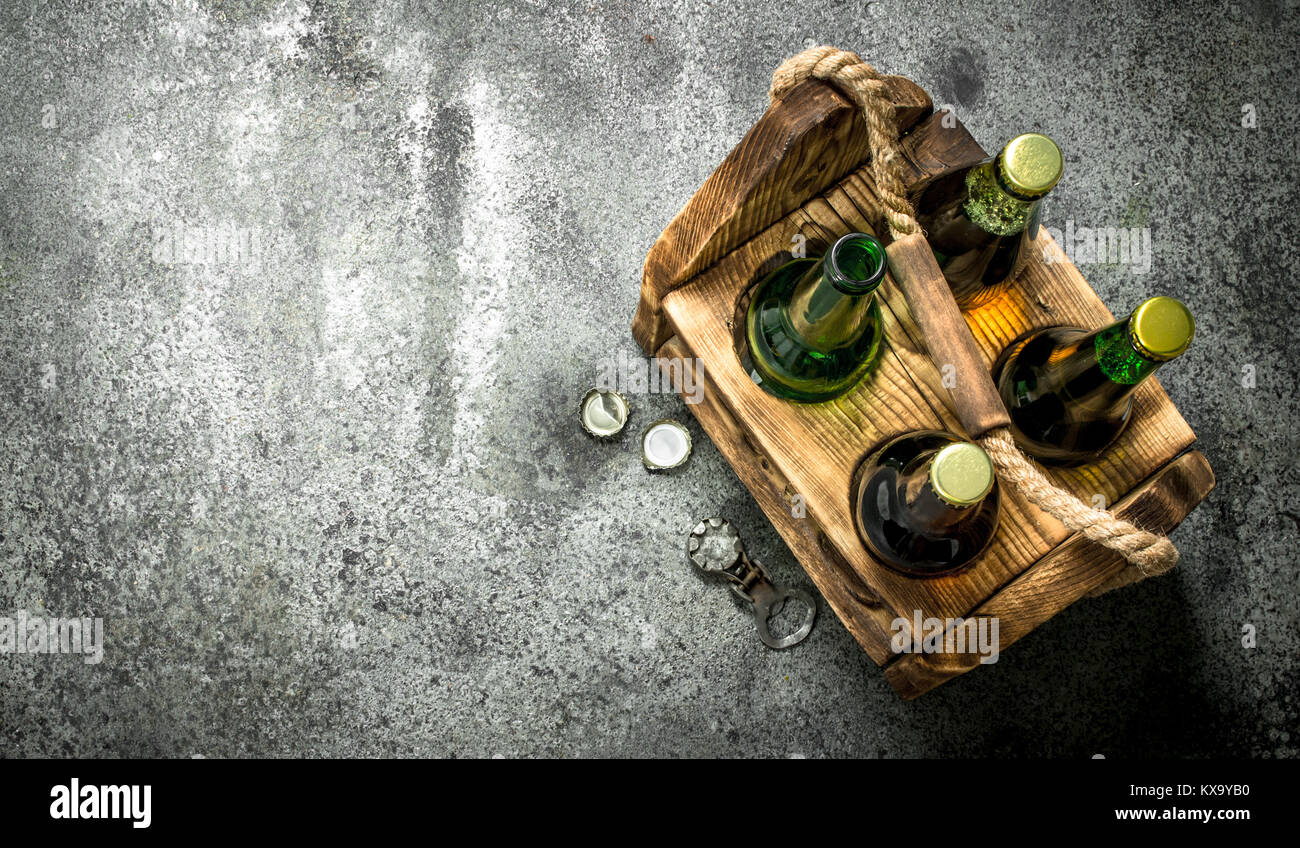 Old box with beer. On a rustic background Stock Photo - Alamy