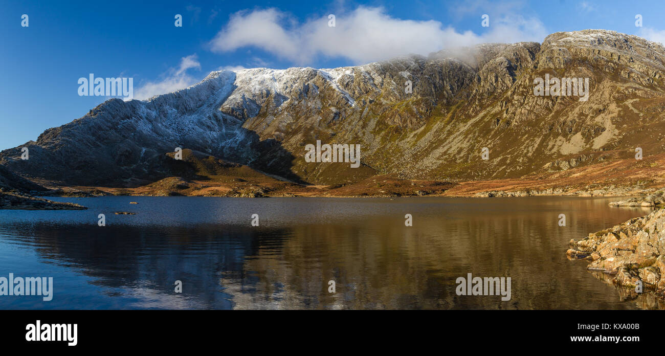 Winter snow on the peak of Moel Siabod, reflected in Llyn Foel at Snowdonia National Park, Wales Stock Photo