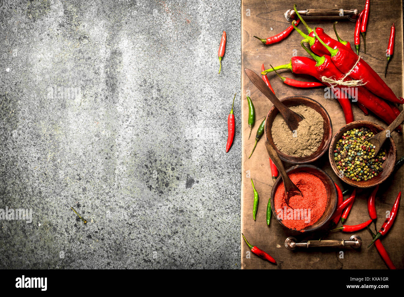 Ground red hot chili peppers in a bowl. On a rustic background Stock ...