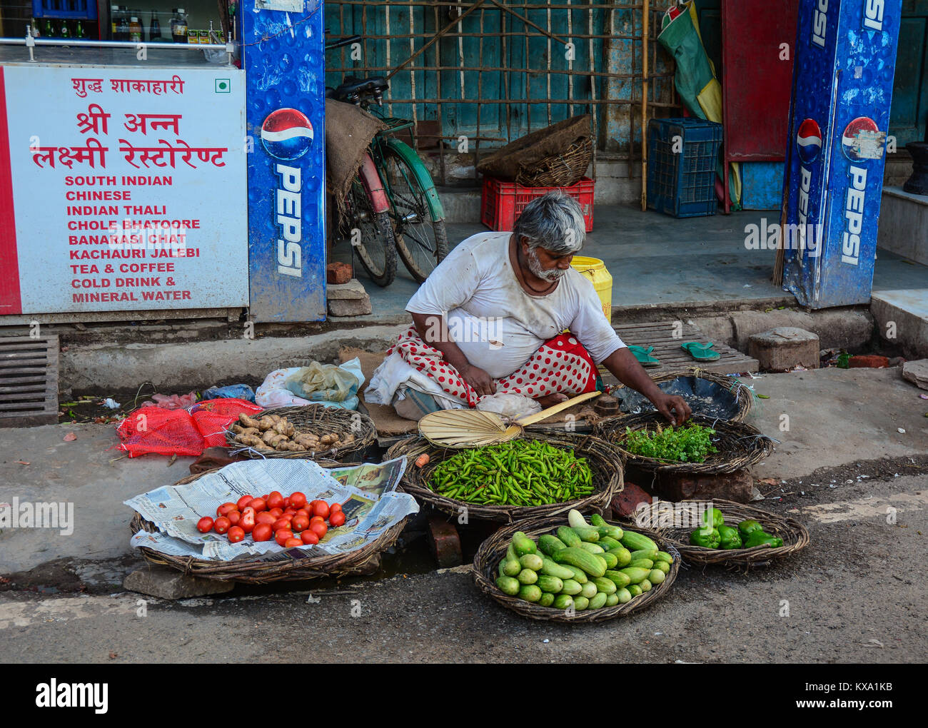 Varanasi, India Jul 12, 2015. A man selling fruits at street market
